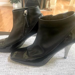 Black high silver heel boots, zipper is on the side. Butter leather top